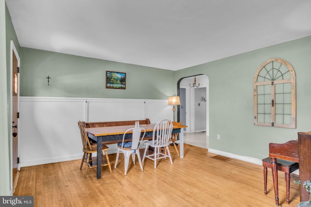 451 C St, Carlisle, PA 17013 - dining room with wood finished floors, arched walkways, and baseboards