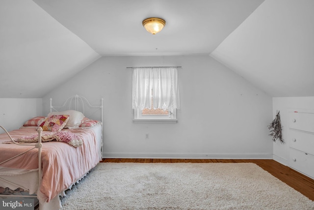 451 C St, Carlisle, PA 17013 - bedroom with wood finished floors, lofted ceiling, and baseboards