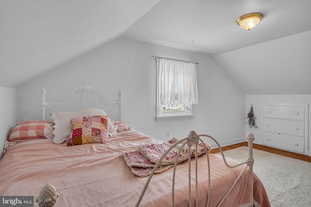 451 C St, Carlisle, PA 17013 - bedroom featuring lofted ceiling, wood finished floors, and baseboards