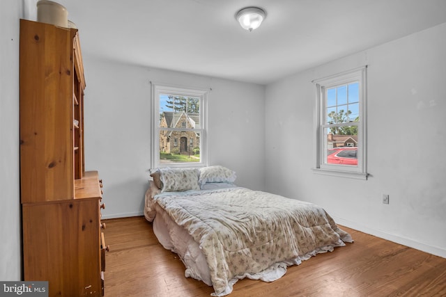 451 C St, Carlisle, PA 17013 - bedroom with multiple windows, hardwood / wood-style floors, and baseboards