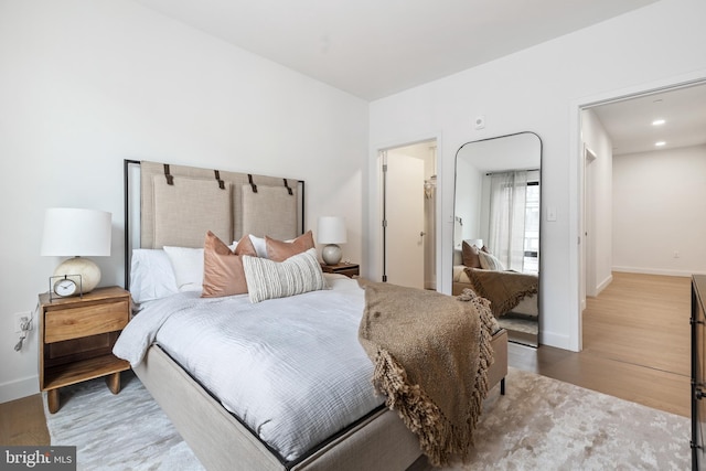 7175 12th St NW Unit 517, Washington, DC 20011 - bedroom featuring wood finished floors, baseboards, and recessed lighting