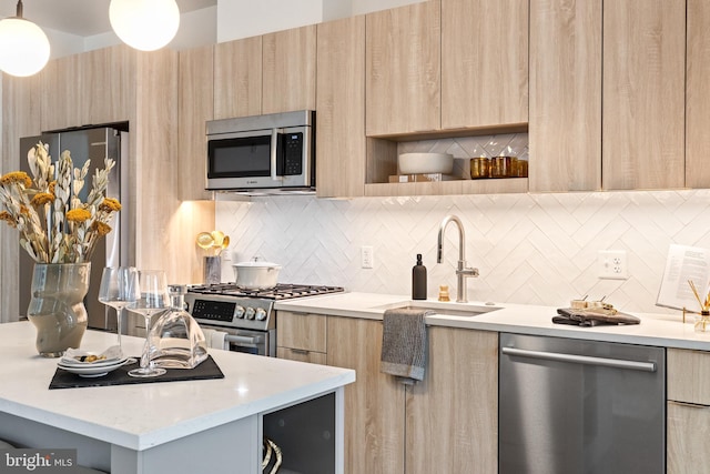 7175 12th St NW Unit 517, Washington, DC 20011 - kitchen with light brown cabinetry, modern cabinets, appliances with stainless steel finishes, a sink, and open shelves