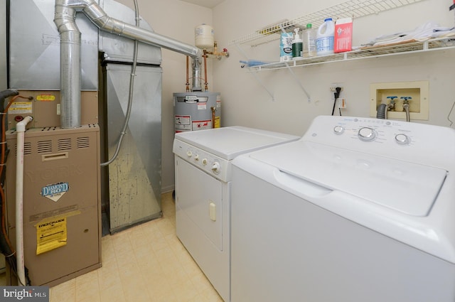 2404 Stokes Rd, Mount Laurel, NJ 08054 - laundry area featuring washing machine and dryer, light floors, water heater, and heating unit