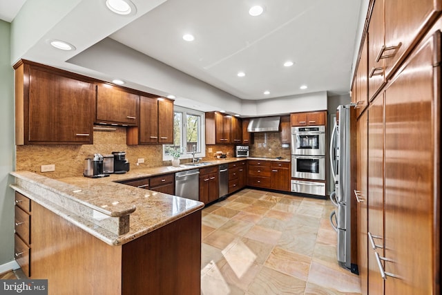 8901 Potomac Station Ln, Potomac, MD 20854 - kitchen featuring appliances with stainless steel finishes, a warming drawer, a peninsula, recessed lighting, and backsplash