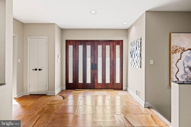 8901 Potomac Station Ln, Potomac, MD 20854 - entryway with recessed lighting, light tile patterned floors, and baseboards