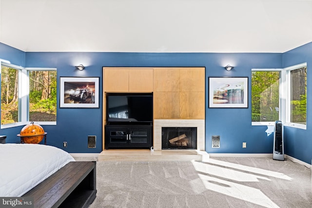 8901 Potomac Station Ln, Potomac, MD 20854 - bedroom with carpet flooring, multiple windows, baseboards, and a fireplace with raised hearth
