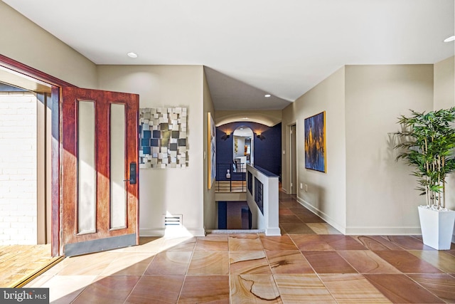 8901 Potomac Station Ln, Potomac, MD 20854 - foyer entrance featuring arched walkways, tile patterned flooring, baseboards, and recessed lighting