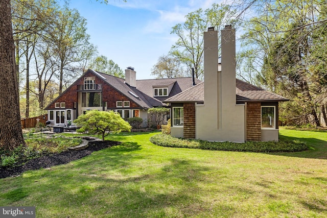 8901 Potomac Station Ln, Potomac, MD 20854 - back of property with a chimney and a shingled roof