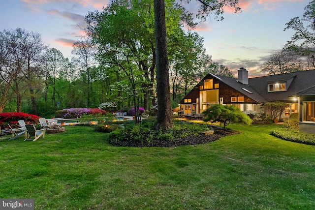 8901 Potomac Station Ln, Potomac, MD 20854 - view of green lawn featuring a fire pit