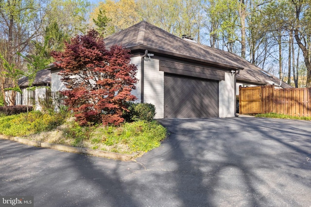 8901 Potomac Station Ln, Potomac, MD 20854 - garage featuring asphalt driveway