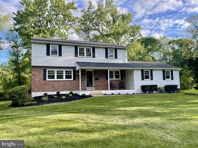 127 Homestead Dr, Doylestown, PA 18901 - view of front of house with a front yard and brick siding