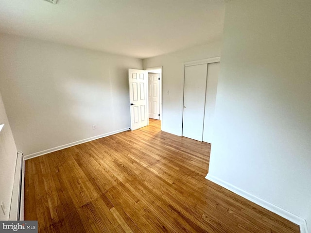127 Homestead Dr, Doylestown, PA 18901 - unfurnished bedroom featuring wood finished floors, baseboards, and a closet