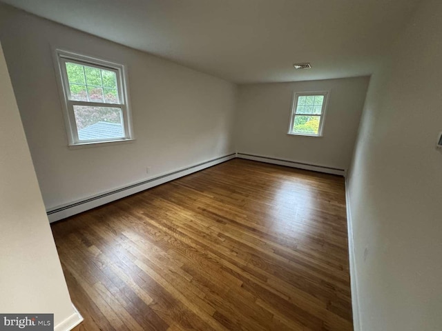 127 Homestead Dr, Doylestown, PA 18901 - empty room featuring baseboard heating, wood finished floors, and a baseboard radiator