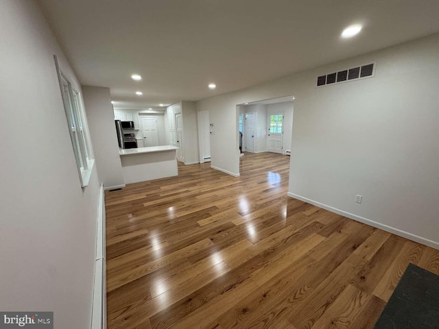 127 Homestead Dr, Doylestown, PA 18901 - unfurnished living room with light wood-type flooring, recessed lighting, and baseboards