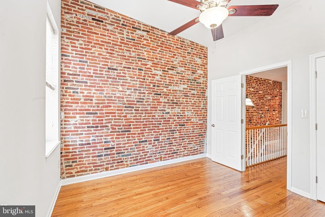 1622 E Clement St, Baltimore, MD 21230 - unfurnished room with brick wall, ceiling fan, wood finished floors, and baseboards