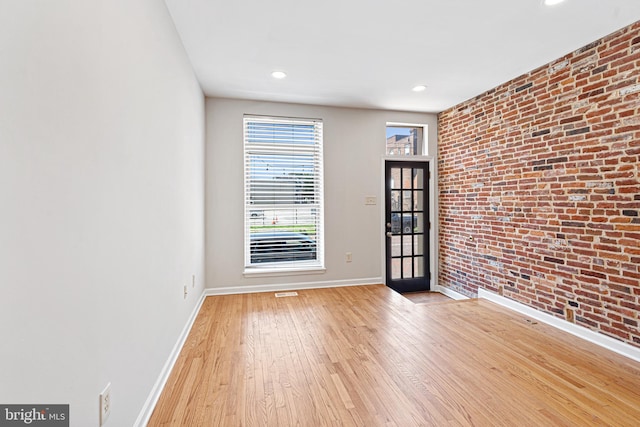 1622 E Clement St, Baltimore, MD 21230 - entryway with brick wall, baseboards, wood finished floors, and recessed lighting