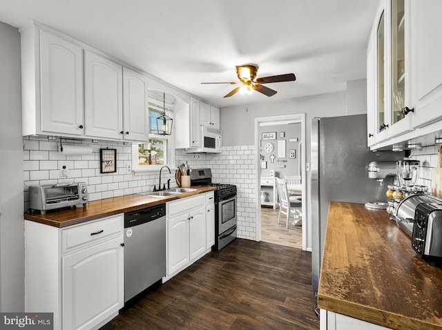 1200 Hessian Ave, National Park, NJ 08063 - kitchen featuring appliances with stainless steel finishes, wooden counters, a sink, ceiling fan, and white cabinetry