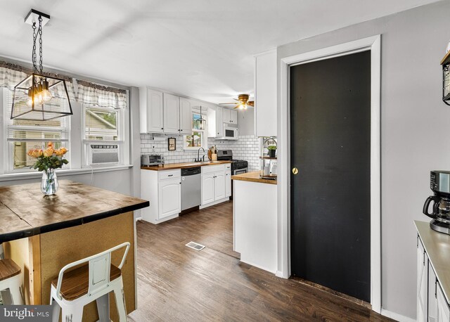 1200 Hessian Ave, National Park, NJ 08063 - kitchen featuring appliances with stainless steel finishes, wooden counters, a sink, dark wood-style floors, and ceiling fan