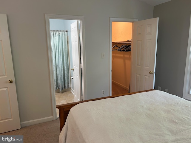15496 Travailer Ct, Woodbridge, VA 22193 - bedroom with baseboards, carpet floors, a spacious closet, connected bathroom, and a closet