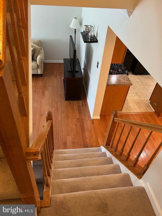 15496 Travailer Ct, Woodbridge, VA 22193 - stairway featuring baseboards and wood finished floors
