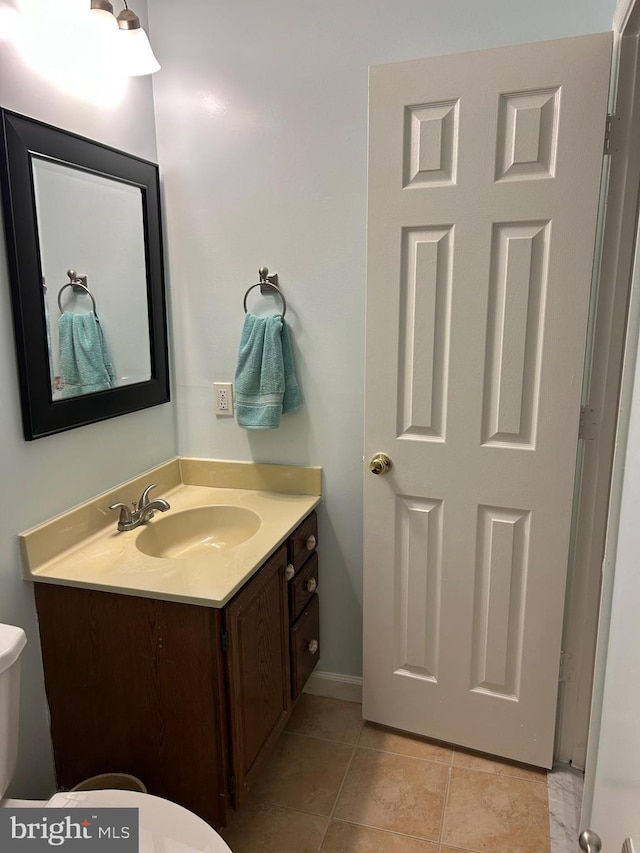 15496 Travailer Ct, Woodbridge, VA 22193 - half bath featuring toilet, vanity, tile patterned floors, and baseboards