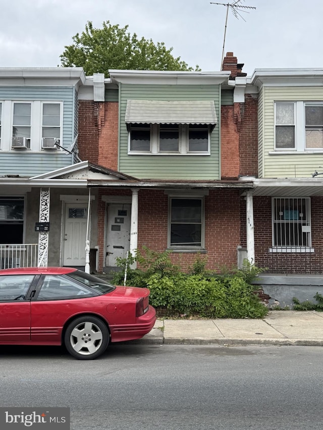 1120 W 9th St, Chester, PA 19013 - view of property with brick siding and a chimney