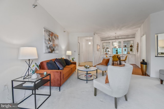 2904 N Leisure World Blvd Unit 517, Silver Spring, MD 20906 - living room featuring a chandelier and light carpet