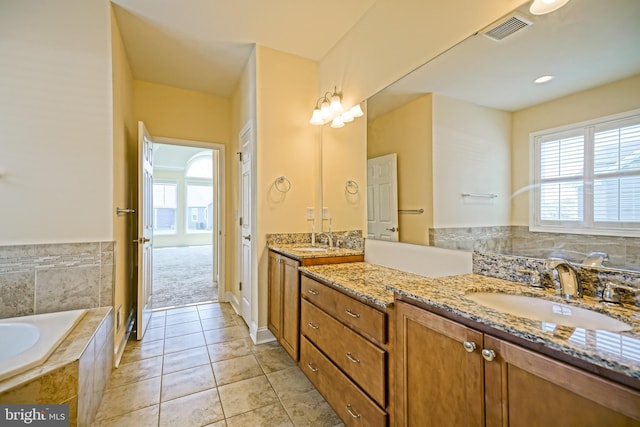 33557 Downing Cir, Lewes, DE 19958 - bathroom featuring double vanity, healthy amount of natural light, a bath, and tile patterned flooring