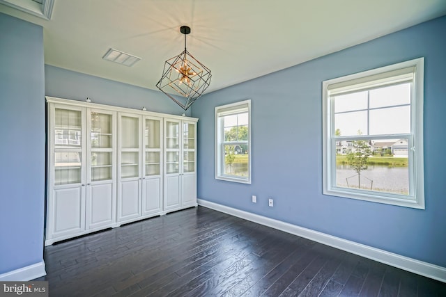 33557 Downing Cir, Lewes, DE 19958 - spare room featuring dark wood-style flooring and a water view