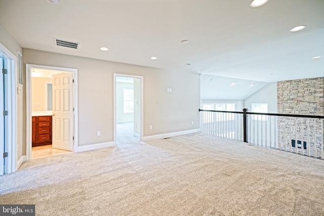 33557 Downing Cir, Lewes, DE 19958 - unfurnished room featuring light colored carpet, plenty of natural light, recessed lighting, and lofted ceiling