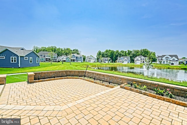 33557 Downing Cir, Lewes, DE 19958 - view of patio featuring a residential view and a water view