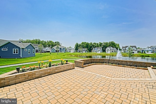 33557 Downing Cir, Lewes, DE 19958 - view of patio with a residential view and a water view