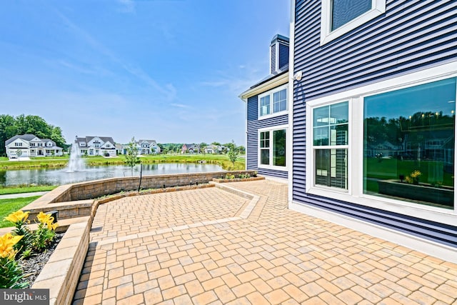 33557 Downing Cir, Lewes, DE 19958 - view of patio / terrace featuring a water view and a residential view