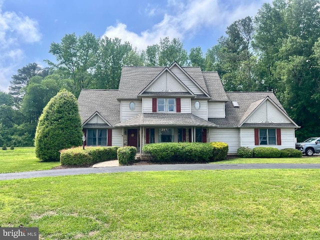 8534 Briar Patch Dr, Denton, MD 21629 - view of front of house with a front yard, covered porch, and a shingled roof