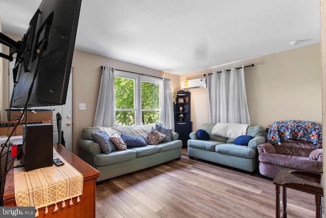 1326 Pine Grove Ave, Baltimore, MD 21237 - living room with a wall mounted air conditioner and wood finished floors