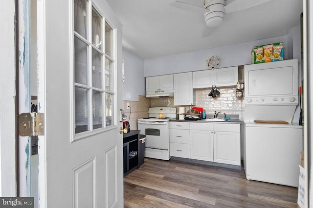 1326 Pine Grove Ave, Baltimore, MD 21237 - kitchen featuring white range with electric cooktop, estacked washer and dryer, under cabinet range hood, a ceiling fan, and white cabinets
