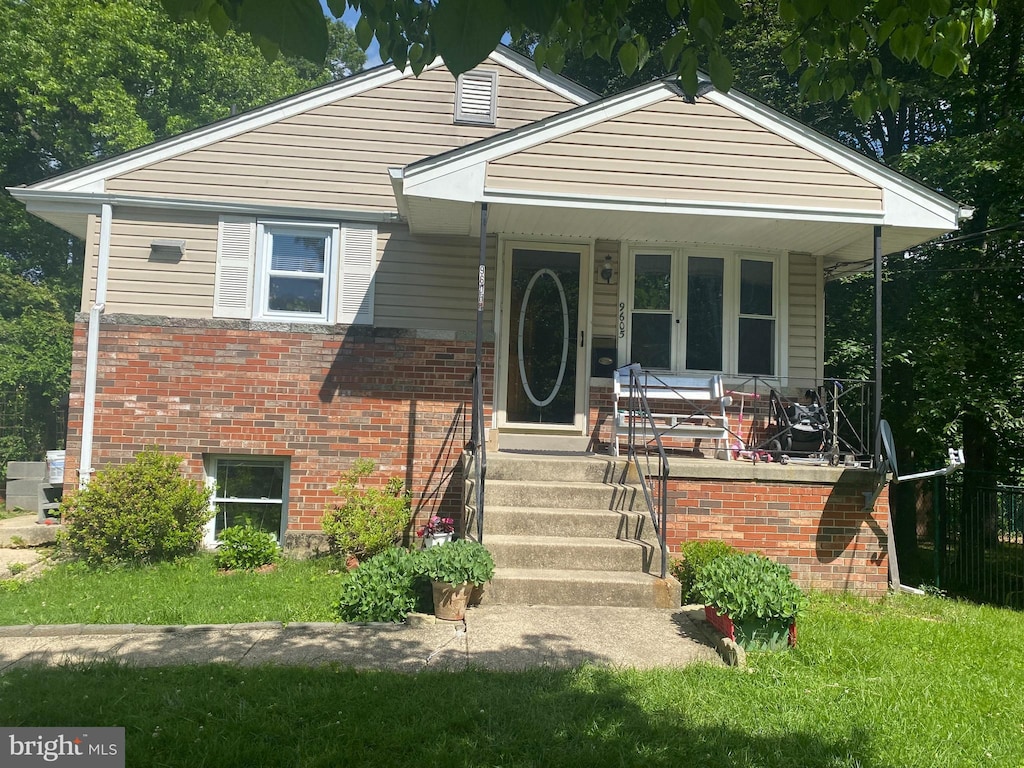9605 49th Ave, College Park, MD 20740 - bungalow featuring brick siding and a porch