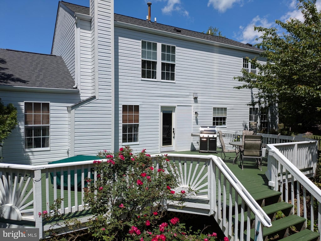 4106 Hartford Ct, Jefferson, MD 21755 - rear view of house featuring a wooden deck, a chimney, and a shingled roof