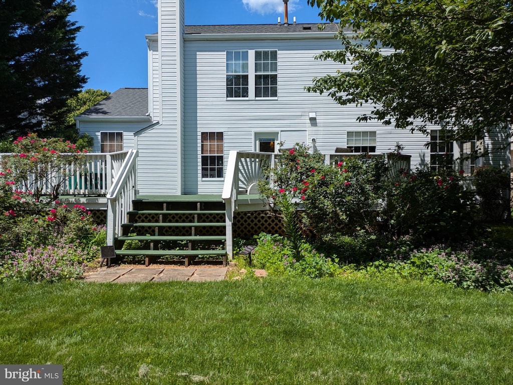 4106 Hartford Ct, Jefferson, MD 21755 - rear view of house with a deck, a chimney, a lawn, and roof with shingles