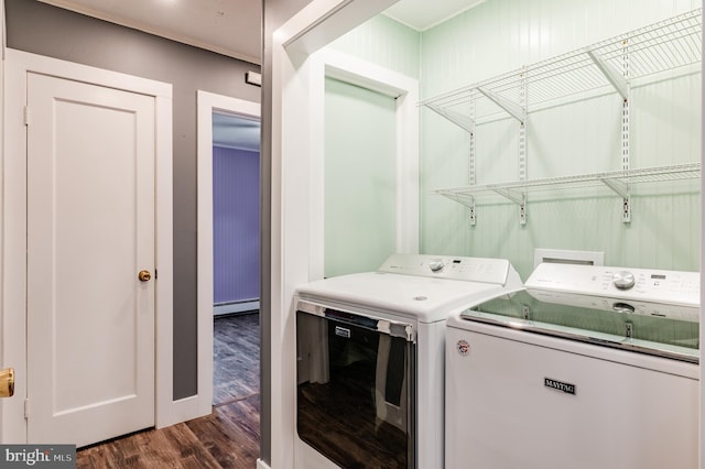 1230 Whitehall Ave, Easton, PA 18045 - laundry room featuring separate washer and dryer, dark wood-style flooring, and a baseboard radiator