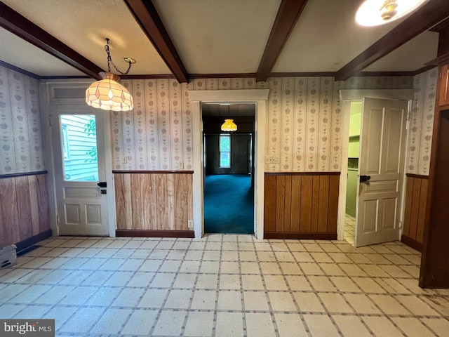 221 S State St, Talmage, PA 17580 - unfurnished dining area with wainscoting, beam ceiling, light floors, and wallpapered walls
