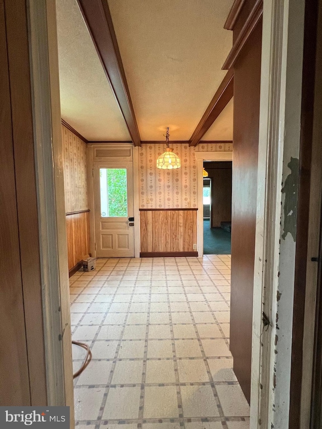 221 S State St, Talmage, PA 17580 - empty room featuring a wainscoted wall, beam ceiling, wood walls, and crown molding