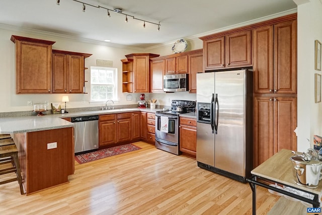 332 Overview St, Waynesboro, VA 22980 - kitchen with stainless steel appliances, a peninsula, brown cabinets, open shelves, and light wood-style flooring