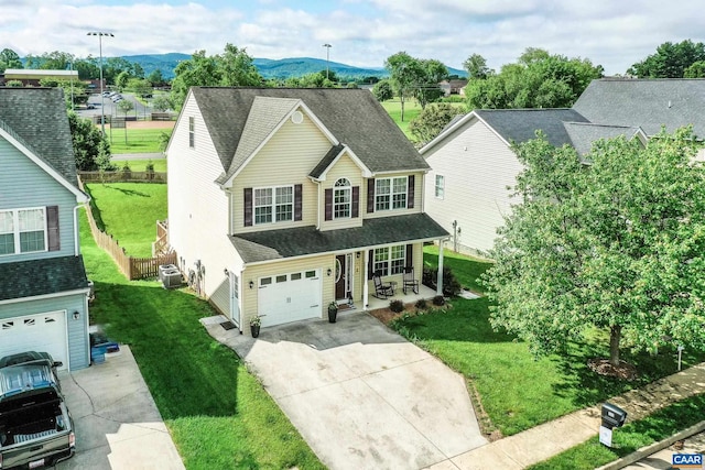 332 Overview St, Waynesboro, VA 22980 - traditional home featuring a porch, driveway, cooling unit, a mountain view, and a garage