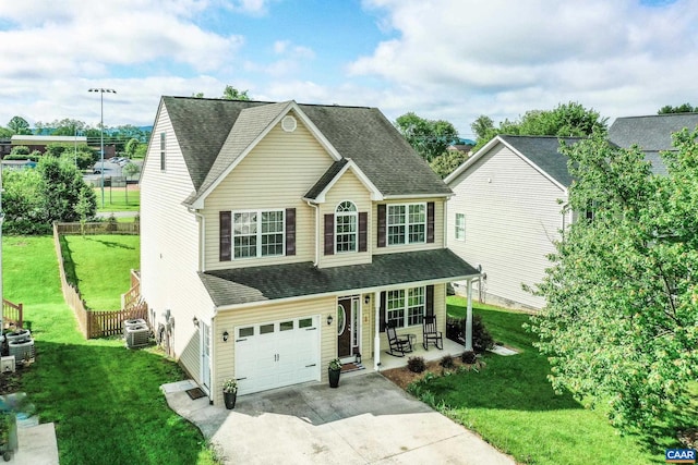 332 Overview St, Waynesboro, VA 22980 - traditional-style home featuring covered porch, central air condition unit, driveway, a garage, and a shingled roof