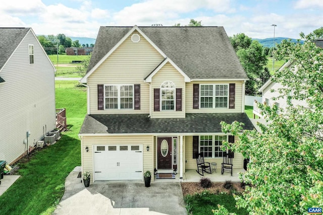 332 Overview St, Waynesboro, VA 22980 - traditional-style home featuring a front yard, driveway, an attached garage, and a shingled roof