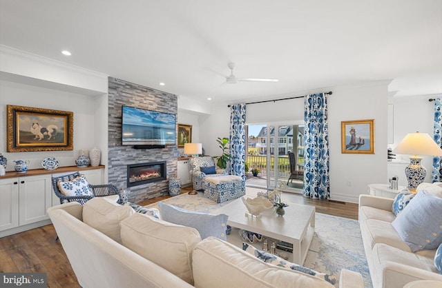 64 Blackpool Rd, Rehoboth Beach, DE 19971 - living area featuring ceiling fan, a fireplace, dark wood-style flooring, recessed lighting, and crown molding
