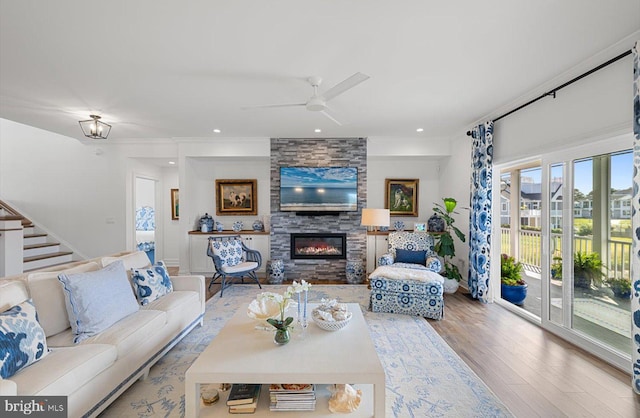 64 Blackpool Rd, Rehoboth Beach, DE 19971 - living room with wood finished floors, a large fireplace, a ceiling fan, recessed lighting, and ornamental molding