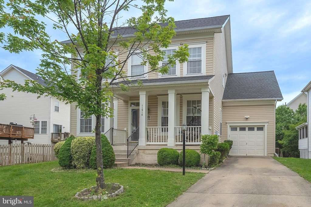 11914 Rayborn Creek Dr, Manassas, VA 20109 - view of front facade with a porch, concrete driveway, and a garage