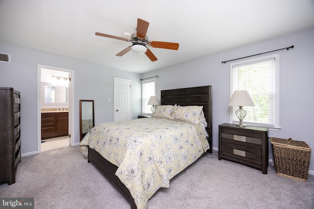 106 Everest Cir Unit 106, West Chester, PA 19382 - carpeted bedroom with multiple windows, baseboards, ensuite bathroom, and a ceiling fan